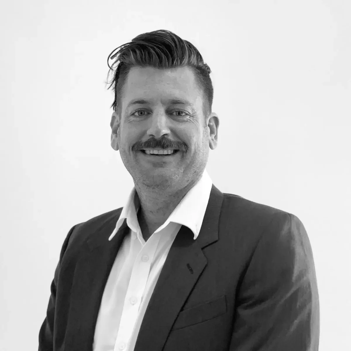 Black & white photograph of Brenton Melville, Payment Solutions Manager at Avinode Group.