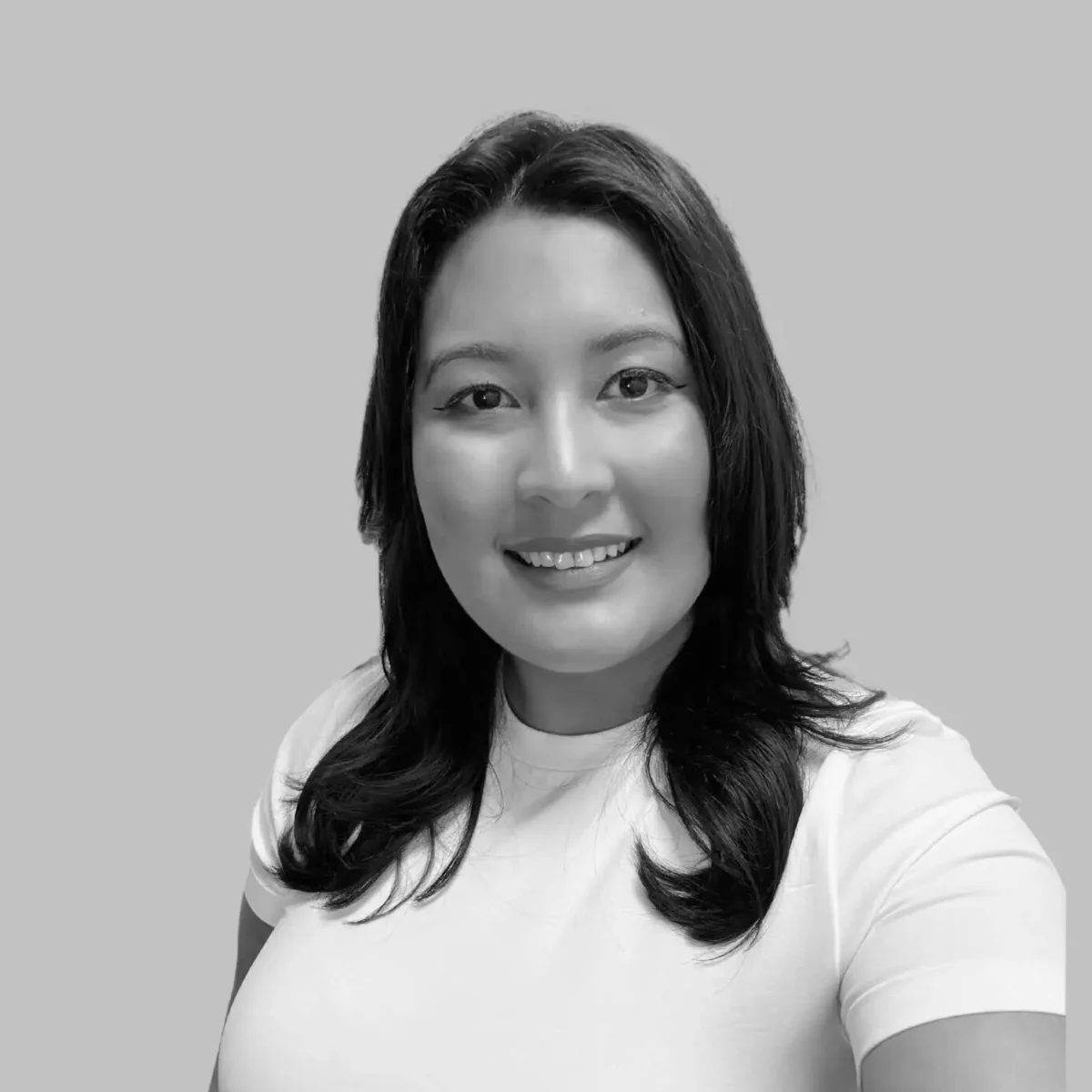 Black and white image of Genesis Dela Cruz, Account Manager at Avinode Group.