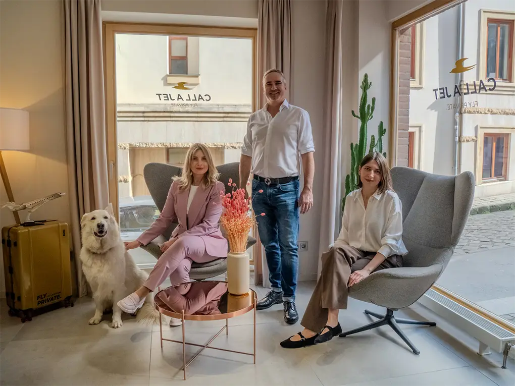 Image of Joe Kurta and wife, dog and colleague at the Call a Jet office in Budapest