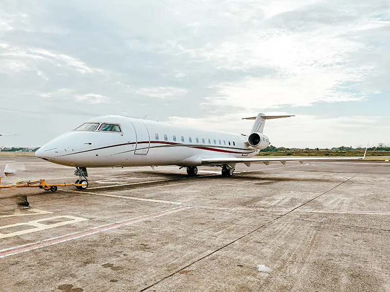 Light image of CeoJetsets PK KAS Challenger 850 on the tarmac with light blue skies