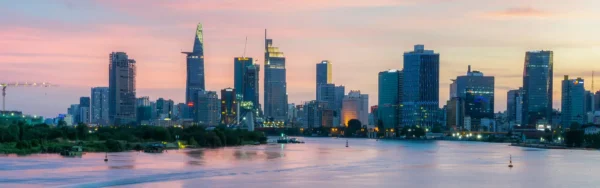 Image of the Ho Chi Minh City, Vietnam skyline at dusk with pink skies