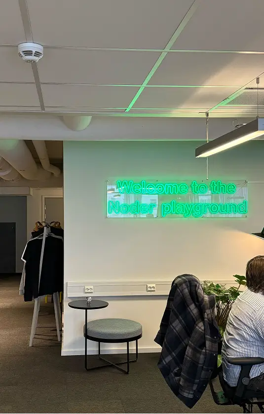Image of green "welcome to the noder playground" in the Avinode Group GOT office