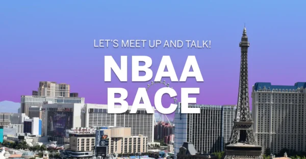 Las Vegas skyline with purple clouds and the text NBAA BACE