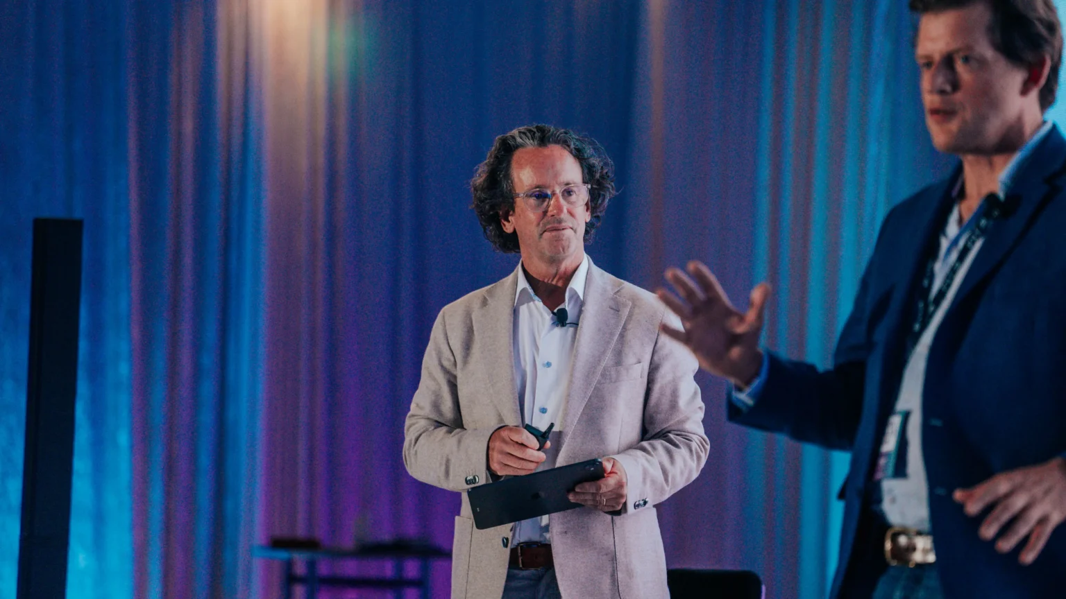 Image of Oliver King and Richard Koe speaking at the State of the Industry keynote at Node Talks 2026.